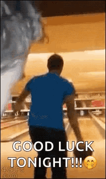 A Man Is Bowling In A Bowling Alley While A Tornado Is Coming In . GIF