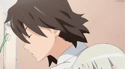 A Man Is Brushing His Teeth With A Toothbrush While A Girl Looks On . GIF