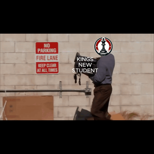 A Man Is Carrying A Bag In Front Of A No Parking Sign GIF