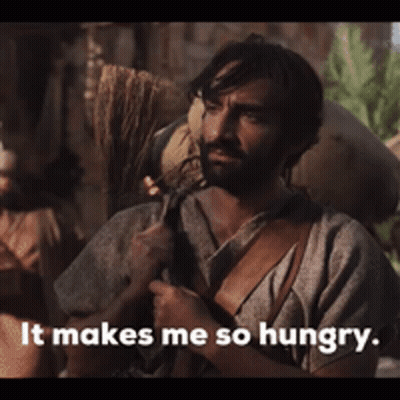 A Man Is Carrying A Bag On His Back And Says " It Makes Me So Hungry " GIF