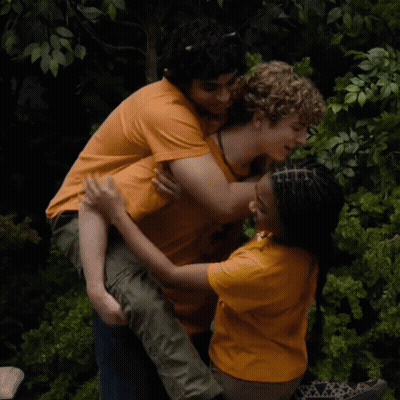 A Man Is Carrying A Girl On His Shoulders GIF