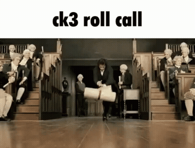 A Man Is Carrying A Large Roll Of Paper In Front Of A Group Of People Sitting On Steps . GIF