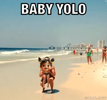 A Man Is Carrying A Little Girl On The Beach With The Words Baby Yolo Below Him GIF