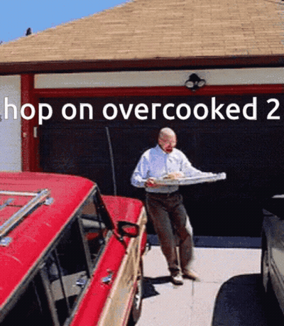 A Man Is Carrying A Tray Of Food In Front Of A Garage Door That Says Hop On Over Cooked 2 GIF
