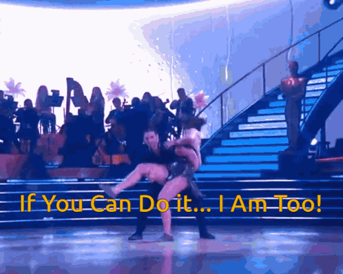 A Man Is Carrying A Woman On A Dance Floor With The Words If You Can Do It I Am Too GIF