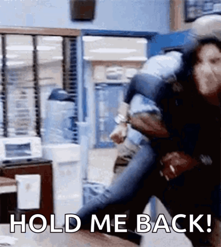 A Man Is Carrying A Woman On His Back With The Words Hold Me Back GIF