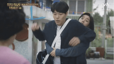 A Man Is Carrying A Woman On His Shoulders In A Tvn Show GIF