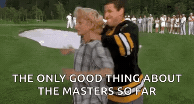 A Man Is Carrying Another Man On His Back On A Golf Course While A Crowd Watches . GIF