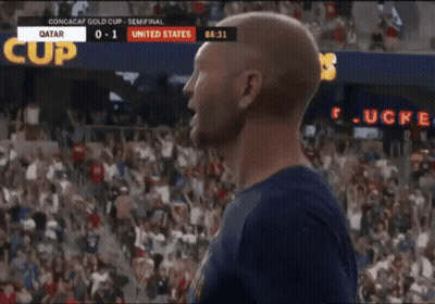A Man Is Celebrating A Goal During A Soccer Game Between Qatar And The United States GIF