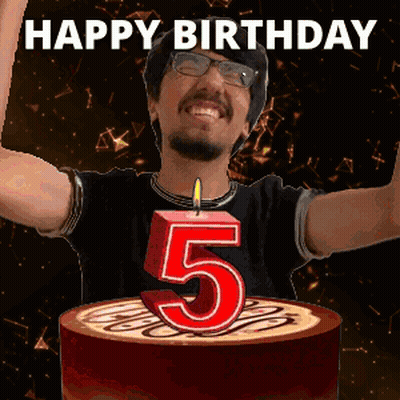 A Man Is Celebrating His 5Th Birthday With A Cake And Candle GIF