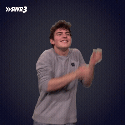 A Man Is Clapping His Hands In Front Of A Swr3 Sign GIF