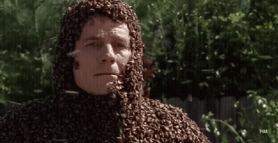 A Man Is Covered In Bees On His Face And Body GIF