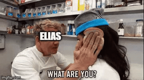 A Man Is Covering A Woman 'S Ear With A Piece Of Bread And Asking What Are You . GIF
