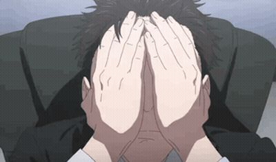 A Man Is Covering His Face With His Hands GIF