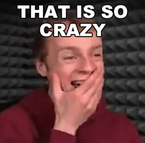A Man Is Covering His Mouth With His Hands And Laughing With The Words That Is So Crazy Written Above Him . GIF