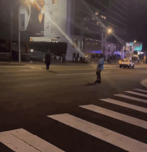A Man Is Crossing A Street With A Sign That Says Seaplane GIF