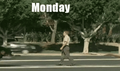 A Man Is Crossing The Street On Monday . GIF