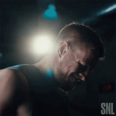 A Man Is Crying In A Dark Room With A Snl Logo In The Corner GIF