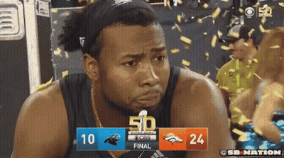 A Man Is Crying In Front Of A Scoreboard That Says 50 GIF