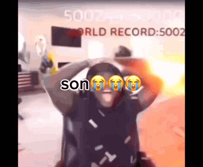 A Man Is Crying In Front Of A Screen That Says Son GIF
