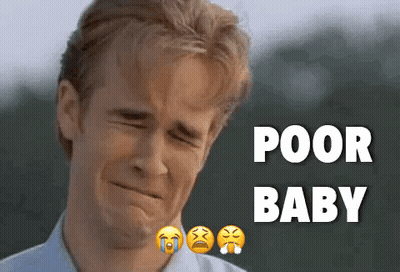 A Man Is Crying In Front Of A Sign That Says " Poor Baby " GIF