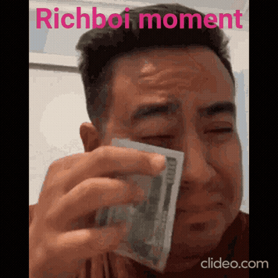 A Man Is Crying While Holding A Stack Of Money With The Words Richboi Moment Written Above Him GIF