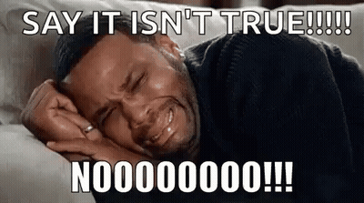 A Man Is Crying While Laying On A Couch With A Caption That Says `` Say It Is N't True ! '' GIF