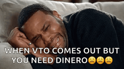 A Man Is Crying While Laying On A Couch With The Words When Vto Comes Out But You Need Dinero GIF