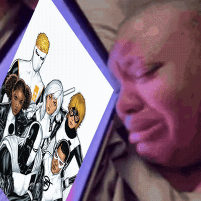A Man Is Crying While Looking At A Comic Book GIF