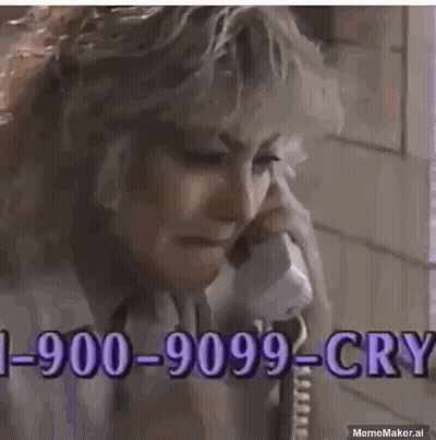 A Man Is Crying While Talking On A Phone With A Phone Number . GIF