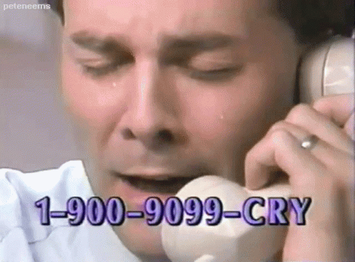 A Man Is Crying While Talking On A Phone With The Number 1-900-9099-Cry GIF