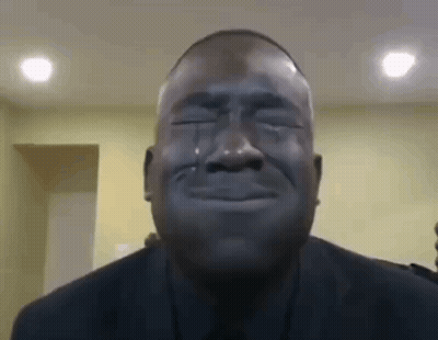 A Man Is Crying With Tears Coming Out Of His Eyes . GIF