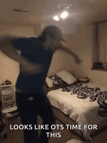 A Man Is Dancing In A Bedroom With The Words `` Looks Like Ots Time For This '' . GIF