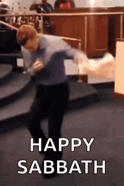 A Man Is Dancing In A Church With The Words `` Happy Sabbath '' Above Him . GIF