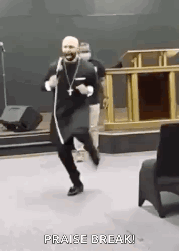 A Man Is Dancing In A Church With The Words `` Praise Break '' Written Above Him . GIF