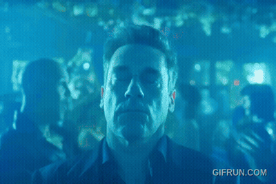 A Man Is Dancing In A Club With A Gif Run.com Watermark GIF