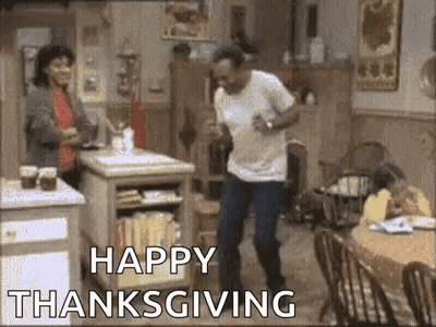 A Man Is Dancing In A Kitchen With The Words `` Happy Thanksgiving '' Written Below Him . GIF