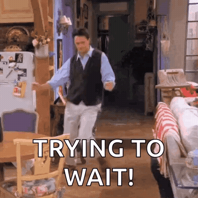 A Man Is Dancing In A Living Room With The Words `` Trying To Wait '' Written On The Bottom . GIF