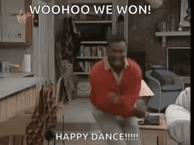 A Man Is Dancing In A Living Room With The Words `` Woohoo We Won ! Happy Dance ! '' GIF