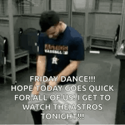 A Man Is Dancing In A Locker Room While Wearing A Blue Shirt And A Hat . GIF