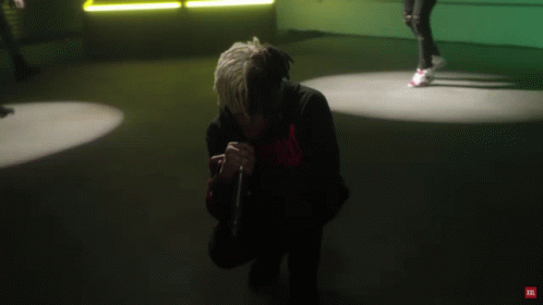 A Man Is Dancing In A Room With A Jbl Logo On The Bottom Right GIF