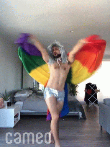 A Man Is Dancing In A Room With The Word Cameo On The Bottom Right GIF