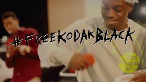 A Man Is Dancing In A Video That Says #Free Kodak Black GIF