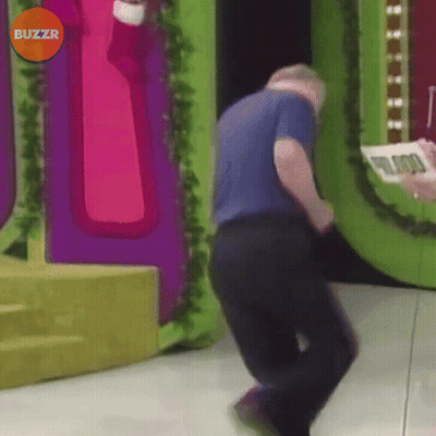 A Man Is Dancing In Front Of A Buzzr Sign GIF