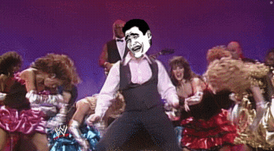 A Man Is Dancing In Front Of A Crowd With A Wrestling Logo On The Bottom GIF