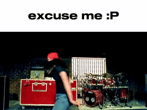 A Man Is Dancing In Front Of A Drum Set With The Words Excuse Me : P On The Bottom GIF