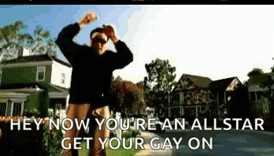 A Man Is Dancing In Front Of A Green House With The Words Hey Now You 'Re An Allstar Get Your Gay On Written Below Him GIF