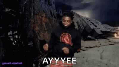 A Man Is Dancing In Front Of A Mountain With The Words Ayy Yee Written On The Screen . GIF
