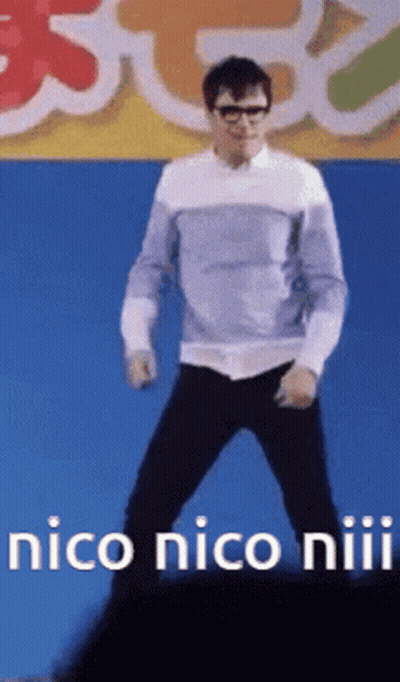 A Man Is Dancing In Front Of A Sign That Says " Nico Nico Niiii " GIF