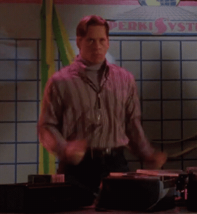 A Man Is Dancing In Front Of A Sign That Says Perki Vs GIF